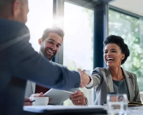 woman shaking hands with a man