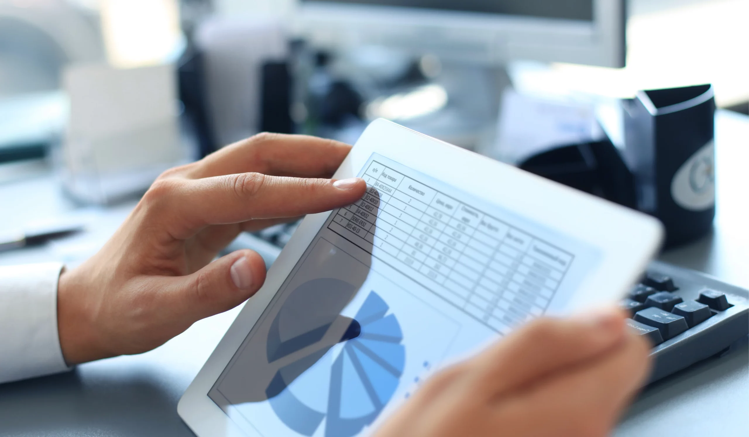 tablet showing excel tables and a pie chart